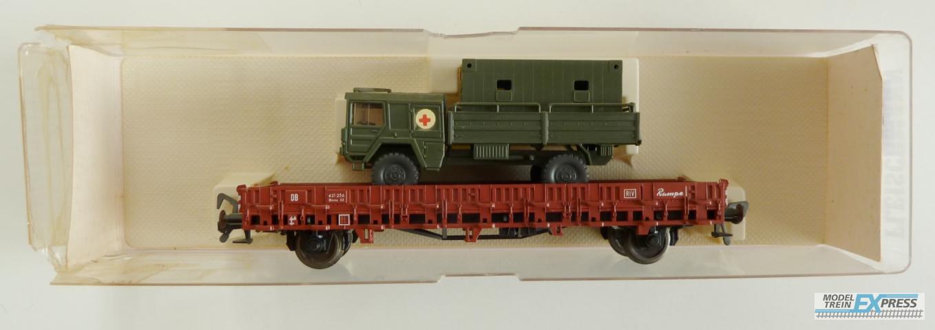 Fleischmann gebruikt materiaal 5222 Rongenwagen beladen met militiair voertuig in goede staat doos slecht.