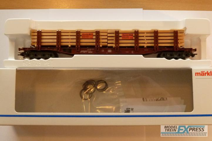Marklin gebruikt materiaal 47714 Marklin rongenwagen beladen met 2 pakken hout Nieuw in doos
