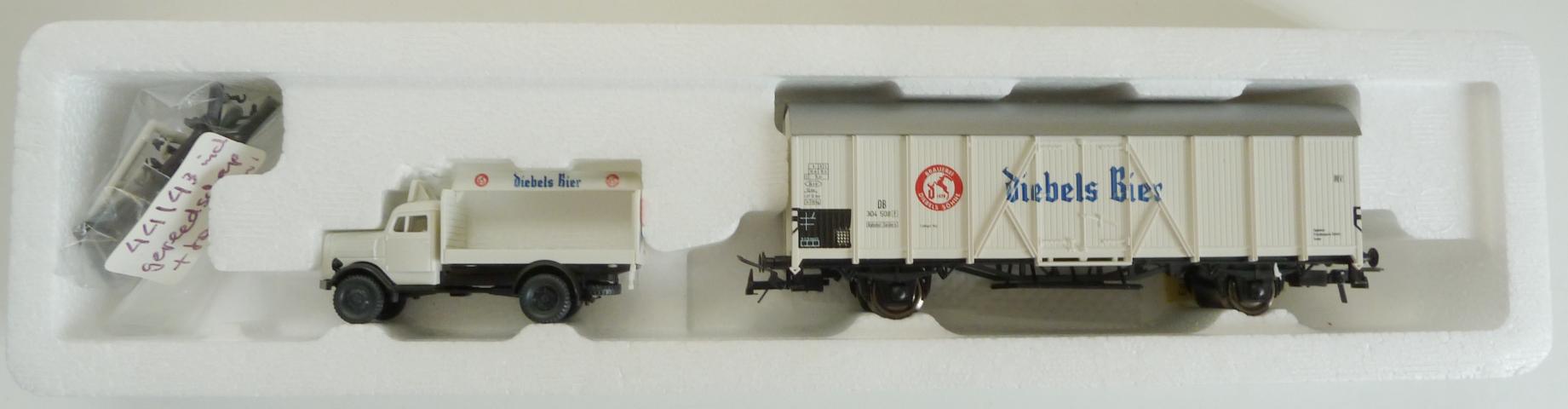 Roco gebruikt materiaal 44143 Roco Bierwagen "Diebels Bier" 304 508 DB met auto z.g.a.n in doos