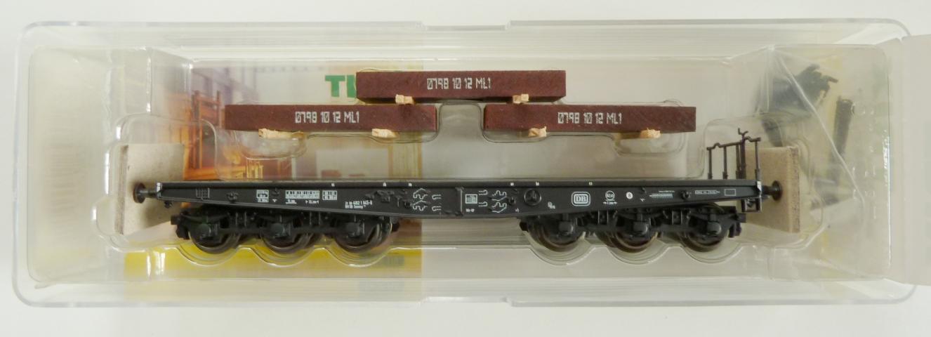 Trix gebruikt materiaal 24057 Schwerlastwagen Flachwagen Sammp 705 der DB mit Stahlbrammen - Ep. IV nieuw in doos